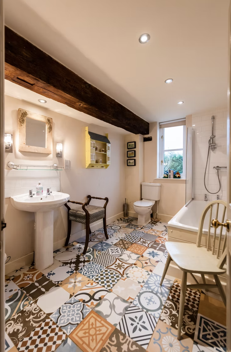 Traditional bathroom with a colourful patterned tile floor